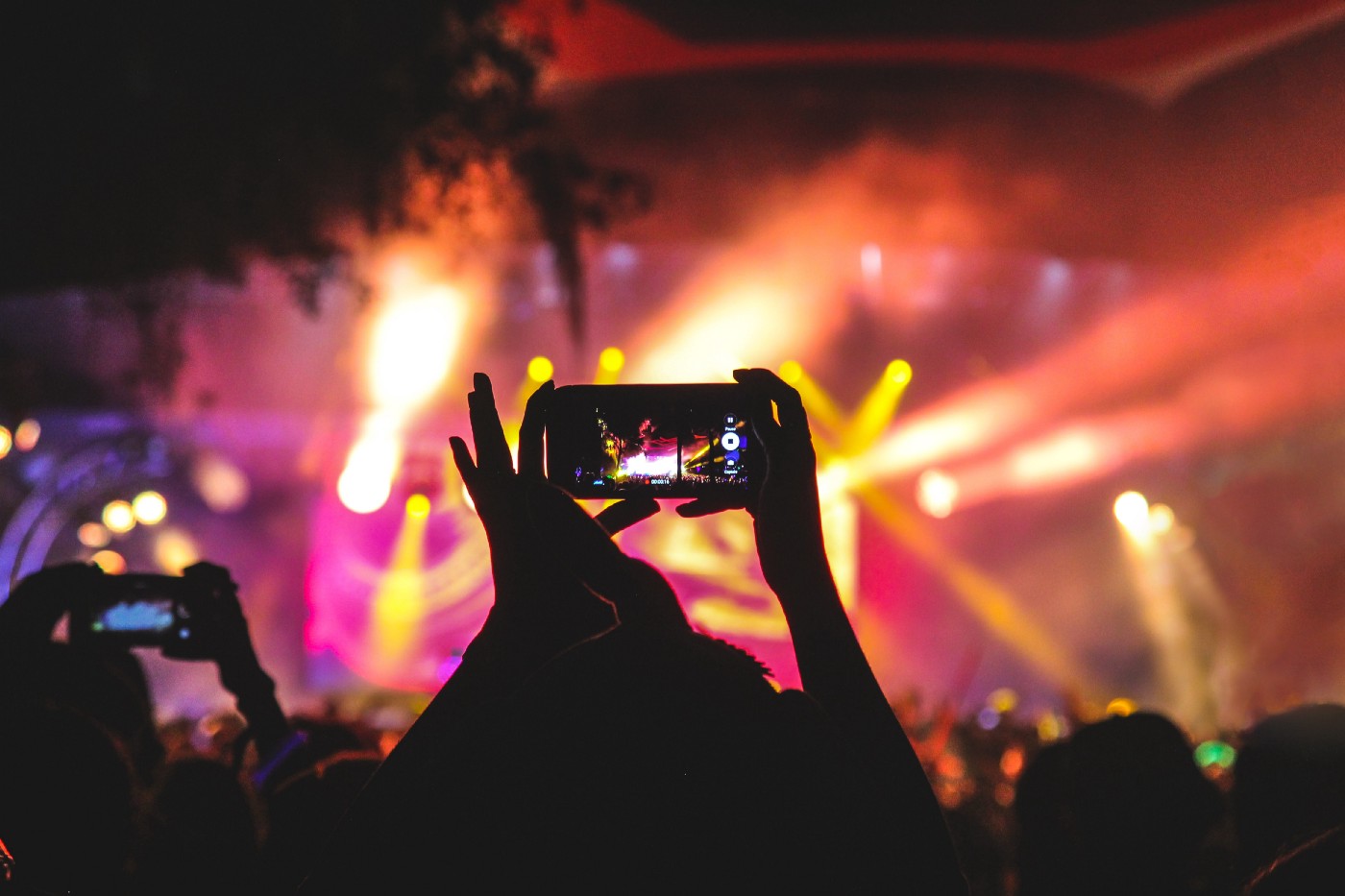 Girl filming a concert